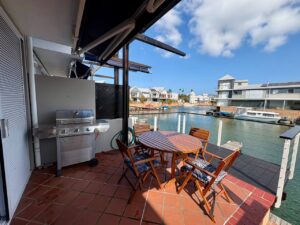 Waterfront balcony at Knysna Quays #23 Spinnaker Drive overlooking the canal.