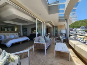 Penthouse bedroom with ocean views at Waves of Grace Herold’s Bay with natural light and calm design.