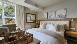 Swell bedroom at Waves of Grace Herold’s Bay with king bed and modern finishes.